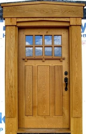 Woodwork/The Sweetgrass Joinery Co. - Front entry door and surround in solid white oak.